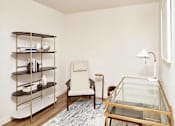 Thumbnail 12 of 36 - Den with desk and book shelf and lounge chair