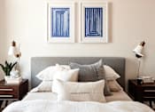 Thumbnail 8 of 36 - Queen bed with headboard, night stands, and pictures hung on wall