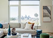 Thumbnail 32 of 36 - Sectional sofa with large windows facing west in living room