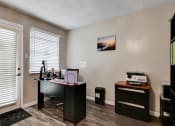 Thumbnail 13 of 20 - an office with a desk and a printer and a door at The Crossings at Montrose Apartments, Texas, 78223