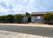 Thumbnail 20 of 20 - two buildings on the side of a street at The Crossings at Montrose Apartments, San Antonio, 78223