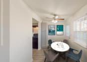 Thumbnail 8 of 41 - a dining room with a table and chairs and a ceiling fan