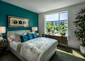 Thumbnail 48 of 57 - A bedroom with a large bed and a view of the outside at Purl Apartments, California, 92108