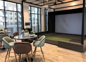 Thumbnail 34 of 57 - A conference room with a table, chairs, and a screen at Purl Apartments, California