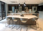 Thumbnail 57 of 57 - A modern dining room with a large table and chairs at Purl Apartments, San Diego, CA, 92108