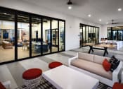 Thumbnail 4 of 26 - a living room with a white couch and tables at Luma at El Corazon Apartments, Oceanside, California