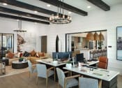 Thumbnail 13 of 26 - a living room and dining room with a table and chairs at Luma at El Corazon Apartments, Oceanside, CA 92056