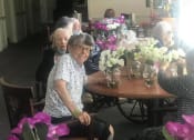 Thumbnail 24 of 34 - Seniors Seating With Flowers at Savannah Court of Brandon, Florida, 33510