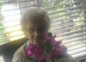 Thumbnail 27 of 34 - Senior Resident With Flowerpot at Savannah Court of Brandon, Brandon, Florida