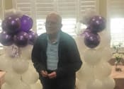 Thumbnail 22 of 34 - Senior Resident With Balloon at Savannah Court of Brandon, Florida, 33510