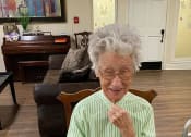 Thumbnail 9 of 34 - Senior Resident In-front Of Laptop at Savannah Court of Brandon, Brandon, Florida