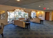 Thumbnail 1 of 59 - Living room with sofas at Savannah Grand of Sarasota, Sarasota, FL