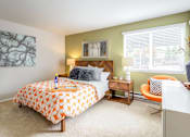 Thumbnail 5 of 20 - a bedroom with a bed and a desk and a window