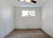 Thumbnail 5 of 15 - Carpeted Bedroom at Xanadu Apartment Homes, Colorado