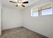 Thumbnail 8 of 15 - Carpeted Bedroom at Xanadu Apartment Homes, Aurora, CO