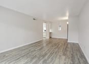 Thumbnail 6 of 11 - Empty Room with Wooden Flooring at Lakeridge Terrace Apartments, Denver, Colorado