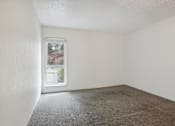 Thumbnail 9 of 11 - Vacant Room with Carpeted Floor at Lakeridge Terrace Apartments, Denver, CO