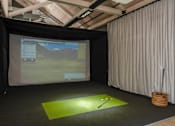 Thumbnail 52 of 113 - a golf simulator in a room with a screen and a golf ball at The Audubon New Haven, New Haven, 06511