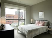 Thumbnail 110 of 113 - a bedroom with a bed and a large window at The Audubon New Haven, Connecticut, 06511