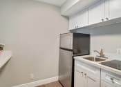 Thumbnail 11 of 38 - a kitchen with a sink and a refrigerator