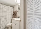 Thumbnail 12 of 38 - a bathroom with a shower and a toilet and a sink