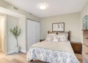 Thumbnail 13 of 38 - a bedroom with a bed and a closet
