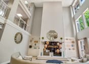 Thumbnail 37 of 38 - the living room of a house with a high ceiling and white furniture