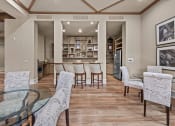 Thumbnail 40 of 40 - club house  with a glass table and chairs and a kitchen in the background