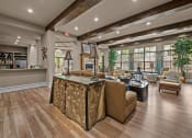 Thumbnail 36 of 40 - club house with a bar and a kitchen