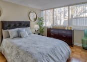 Thumbnail 10 of 50 - a bedroom with a large bed and two windows