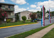 Thumbnail 10 of 17 - Lilly Garden Apartments Building Flags 14