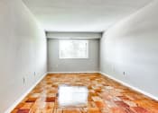 Thumbnail 6 of 40 - an empty room with wood floors and a window