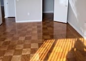 Thumbnail 39 of 40 - A room with a checkered floor and three doors.