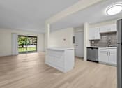 Thumbnail 10 of 111 - A kitchen with white cabinets and a wooden floor.