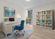 Thumbnail 8 of 111 - A room with a desk, chair, and bookshelf.