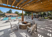 Thumbnail 21 of 29 - Poolside firepit and seating