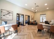 Thumbnail 18 of 29 - a large office with desks and chairs and a wood floor