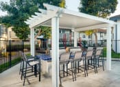 Thumbnail 19 of 28 - Stone Arbor Pool Barbecue Area