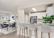 Thumbnail 2 of 24 - an open kitchen and dining room with a table and chairs