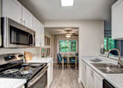 Thumbnail 6 of 24 - view from kitchen to dining room