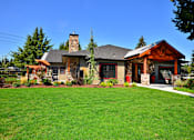 Thumbnail 22 of 24 - a home with green grass and a blue sky