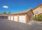 Thumbnail 18 of 18 - a garage with three doors in front of a house