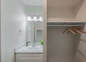 Thumbnail 9 of 19 - a bathroom with a sink and a mirror