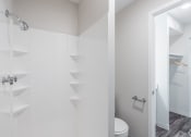 Thumbnail 8 of 19 - a bathroom with a toilet and a shower