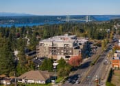 Thumbnail 1 of 14 - an aerial view of a building with a bridge in the background