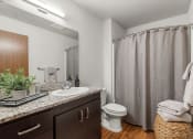 Thumbnail 9 of 27 - a bathroom with a sink and a toilet and a shower at Latitude 47, University Place