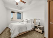 Thumbnail 8 of 27 - a bedroom with a bed and a window at Latitude 47, University Place