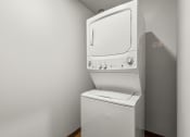 Thumbnail 10 of 27 - a washer and dryer in a room with a white wall and a white at Latitude 47, University Place