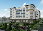 Thumbnail 36 of 36 - A modern apartment building with a parking lot in front.