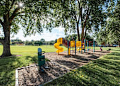 Thumbnail 1 of 24 - A playground with a yellow slide and a green toy chest.